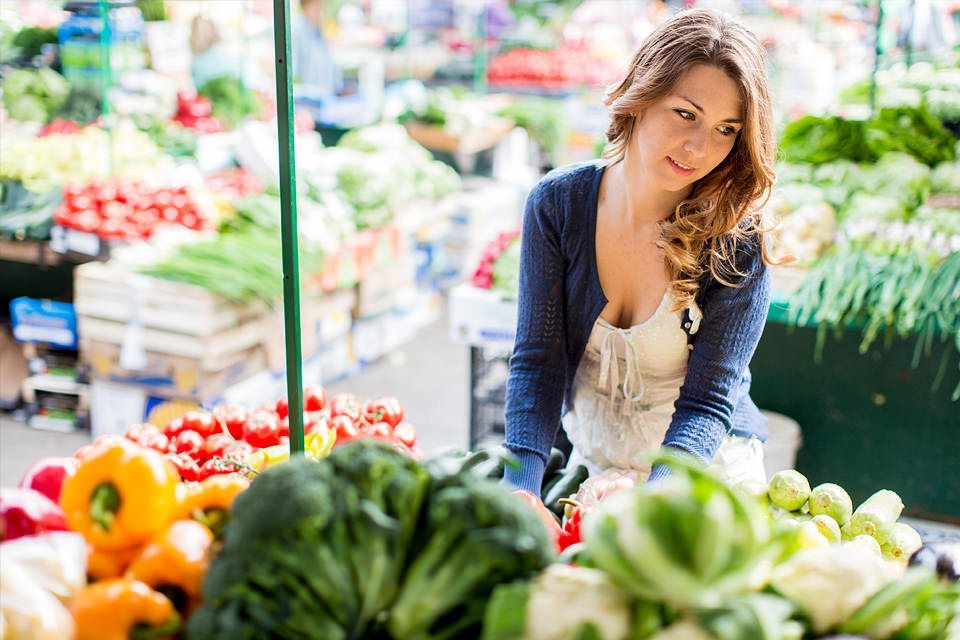 woman looking at fresh produce